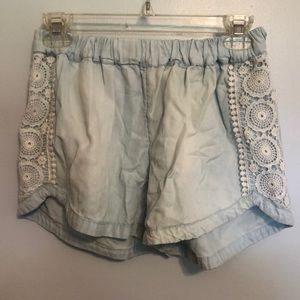 light blue shorts with white pattern